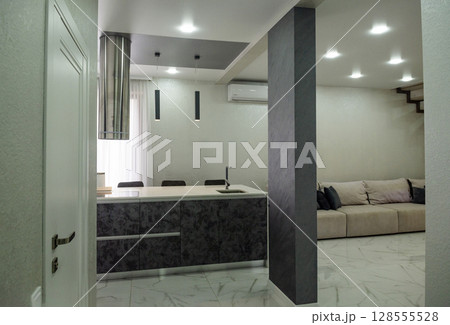 The kitchen is very bright with a modern design. The kitchen is very bright with a modern design. 128555528