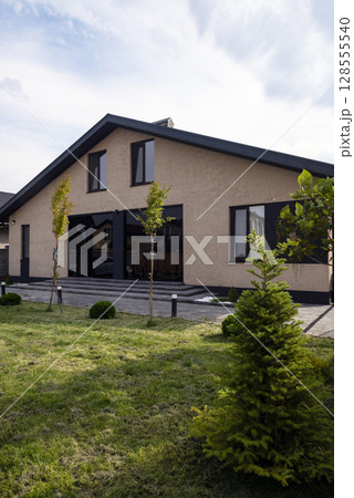 Courtyard of a private house. one-story house, lawn, playground. 128555540