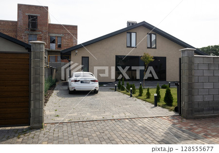 Interior house of a private household. there is a car in the yard. 128555677