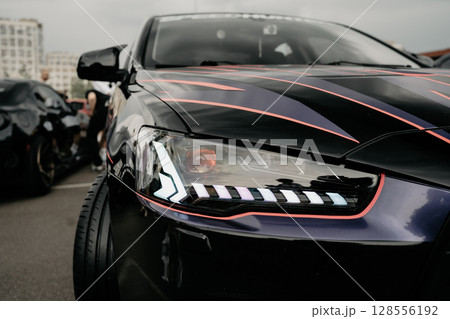 headlight of modern prestigious car close up. 128556192