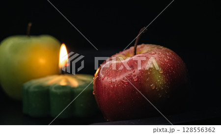 Apples and Candlelight - Cozy Still Life with Water Droplets Apples and Candlelight - Cozy Still Life with Water Droplets 128556362