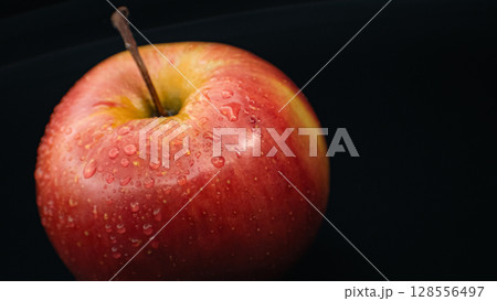 Tempting Apple with Water Droplets - Macro Elegance 128556497