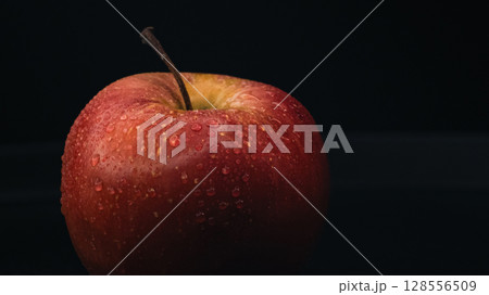 Red Apple on Black Background - Minimalist Still Life Red Apple on Black Background - Minimalist Still Life 128556509