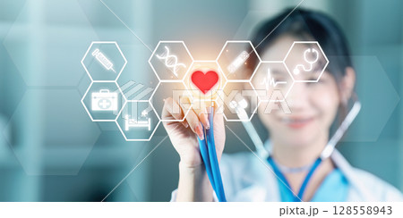 Modern Doctor Interacting with Futuristic Medical Interface in a Hospital Setting Modern Doctor Interacting with Futuristic Medical Interface in a Hospital Setting 128558943