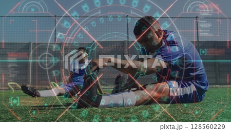 Image of scope scanning and data processing over football players warming up Image of scope scanning and data processing over football players warming up 128560229
