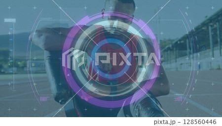Image of scope scanning over disabled male athlete with running blades on racing track 128560446