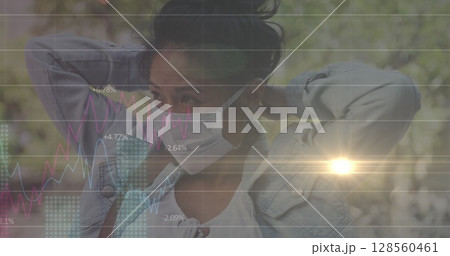 Image of data processing over woman wearing face mask 128560461