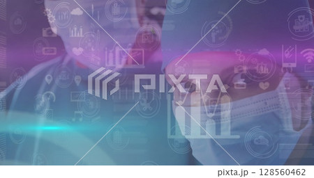 Image of data processing over surgeons wearing face masks 128560462