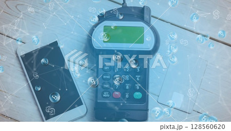 Image of bitcoins over smartphone and payment terminal 128560620
