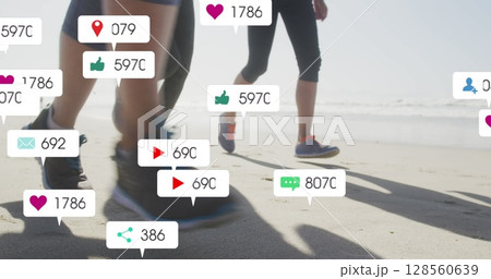 Image of social media notifications, over women running on beach Image of social media notifications, over women running on beach 128560639