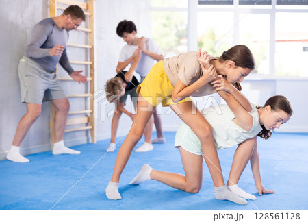 Two girls training self-defense techniques 128561128