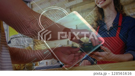 Image of network security padlock over people using payment terminal 128561616