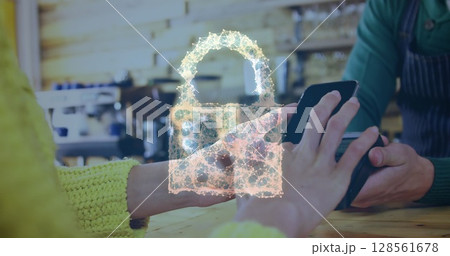 Image of network security padlock over people using payment terminal Image of network security padlock over people using payment terminal 128561678