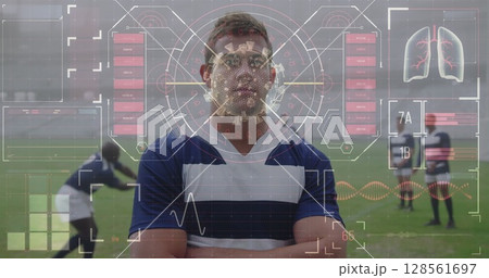 Athlete in rugby jersey standing confidently with digital health data overlay 128561697