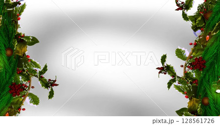 Image of fir trees branches and decorations over white background 128561726