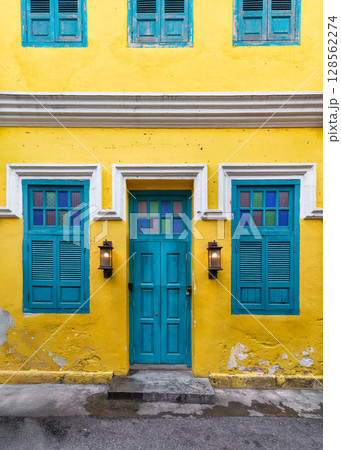 Vibrant Yellow Shophouse with Blue Door and Windows, Kuala Lumpur, Malaysia Vibrant Yellow Shophouse with Blue Door and Windows, Kuala Lumpur, Malaysia 128562274