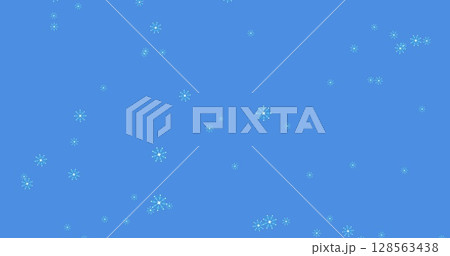 Image of snowflakes falling with red spots over blue background 128563438