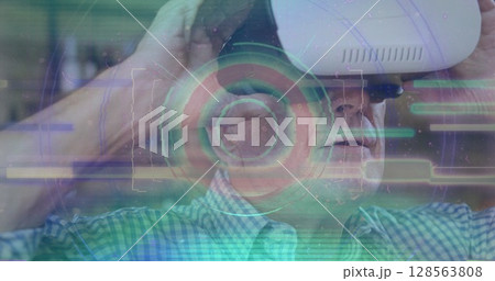 Image of scope scanning and data processing over man wearing vr headset Image of scope scanning and data processing over man wearing vr headset 128563808