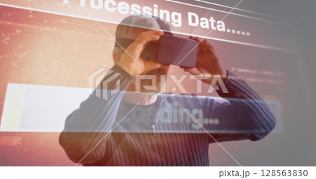 Image of data processing over man using vr headset 128563830