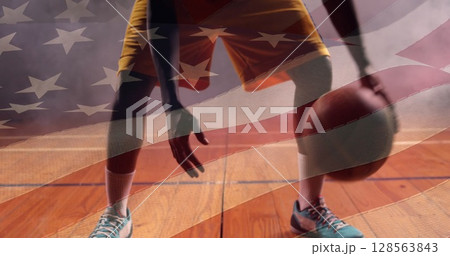 Image of flag of united states of america over african american basketball player Image of flag of united states of america over african american basketball player 128563843