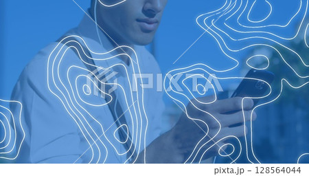 Image of moving shapes over man using smartphone 128564044