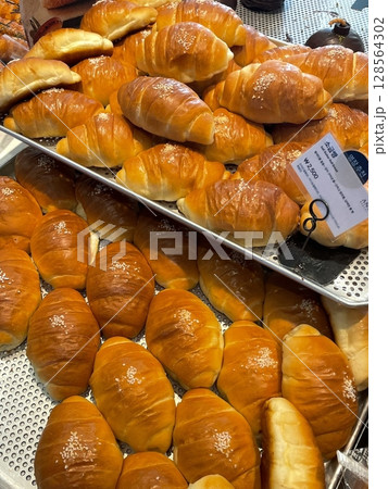 Golden, flaky salt bread with a buttery aroma, paired with bold black coffee for a perfect balance of savory and bitter flavors. A simple yet satisfying combination for breakfast or a coffee break! Golden, flaky salt bread with a buttery aroma, paired with bold black coffee for a perfect balance of savory and bitter flavors. A simple yet satisfying combination for breakfast or a coffee break! 128564302