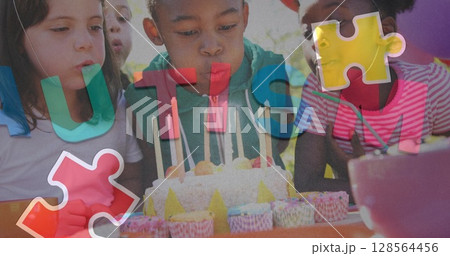 Image of colourful puzzle pieces and autism text over children with birthday cake at party 128564456