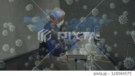 Image of covid 19 cells over senior man wearing face mask Image of covid 19 cells over senior man wearing face mask 128564575