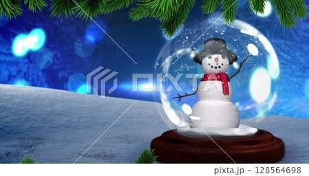 Image of christmas snow globe over spots 128564698