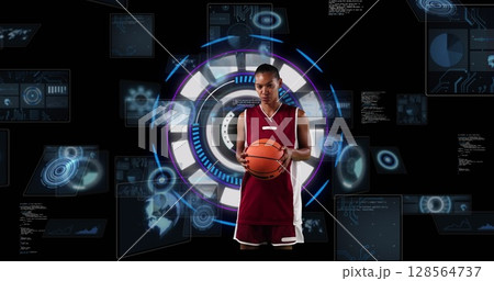 Image of african american female basketball player over scope scanning on black background 128564737