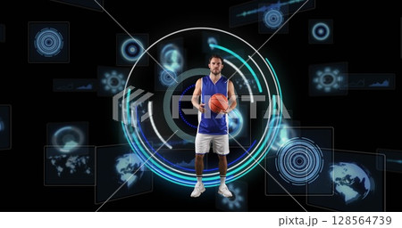 Image of caucasian male basketball player over scope scanning on black background 128564739