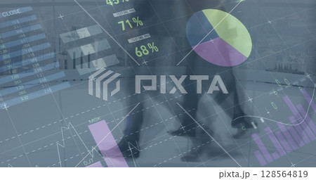 Image of financial data processing over diverse business people walking in modern office 128564819