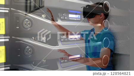 Image of computer server over schoolboy wearing vr headsets 128564821