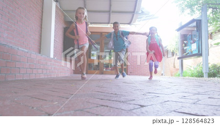 Image of happy teachers day text over diverse schoolchildren smiling and running 128564823