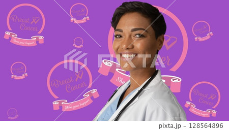 Image of breast cancer awareness text over smiling african american female doctor Image of breast cancer awareness text over smiling african american female doctor 128564896
