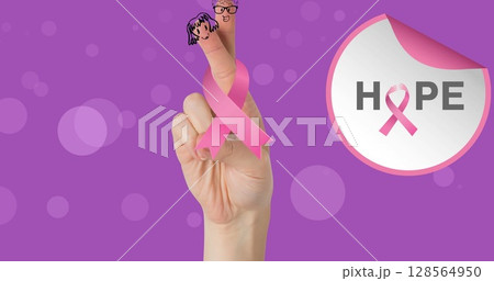Image of breast cancer awareness text over hand and pink breast cancer ribbon 128564950
