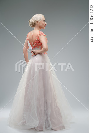 Bridal pose with a striking contrast of elegance and unsettling elements Bridal pose with a striking contrast of elegance and unsettling elements 128566212