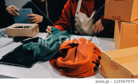 Portrait of Starting small businesses SME owners, two Asian woman check online orders Selling products working with boxs freelance work at home office, sme business online small medium enterprise 128567075