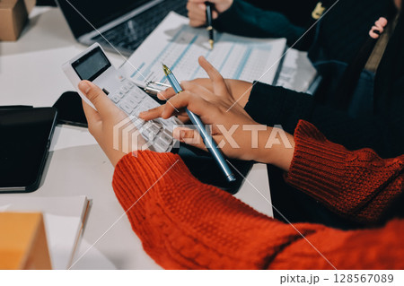 Portrait of Starting small businesses SME owners, two Asian woman check online orders Selling products working with boxs freelance work at home office, sme business online small medium enterprise 128567089