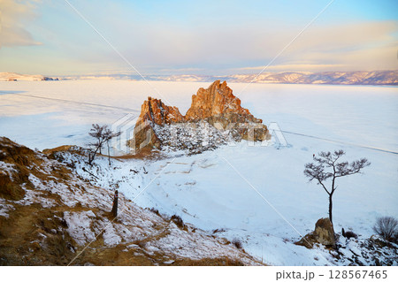 View of Cape Burhan or Shamanka rock on Olkhon island in winter.  128567465