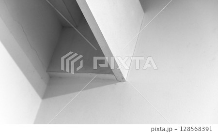 Abstract wall composition showcasing clean geometric angles 128568391