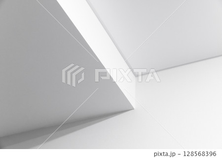 Angular white walls create a minimalist abstract composition 128568396