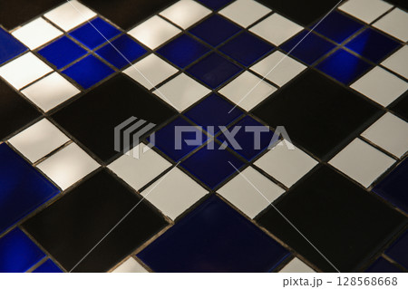 Close-up view of a colorful tiled surface with geometric shapes 128568668
