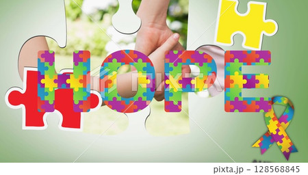 Image of autism colourful puzzle pieces forming and hope text over mother and child 128568845