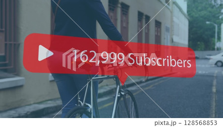 Image of social media notification over african american woman wheeling bike in street Image of social media notification over african american woman wheeling bike in street 128568853