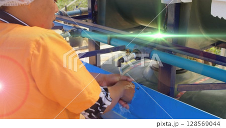 Image of red light spots over african american woman washing hands outdoors at standpipe Image of red light spots over african american woman washing hands outdoors at standpipe 128569044