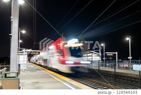 Motion-blurred San Jose - San Francisco commuter train arriving at San Bruno station in the Bay Area, California, United States Motion-blurred San Jose - San Francisco commuter train arriving at San Bruno station in the Bay Area, California, United States 128569103