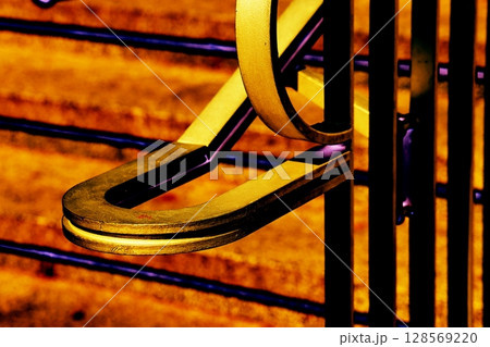 Metal railing on the stairs as a colorful background, changed color scheme. Metal railing on the stairs as a colorful background, changed color scheme. 128569220
