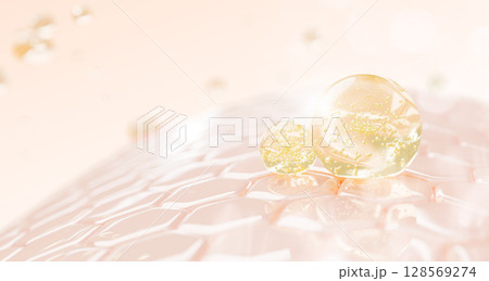 3d oil drops texture on epidermis skin layer with hexagon cell pattern. Cosmetic skincare render background with gold liquid bubbles of collagen serum, retinol gel, hyaluronic essence. 3D illustration 128569274