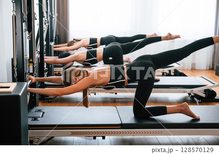 Exercises for the spine. Women in fitness center 128570129